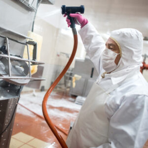 Man cleaning in factory